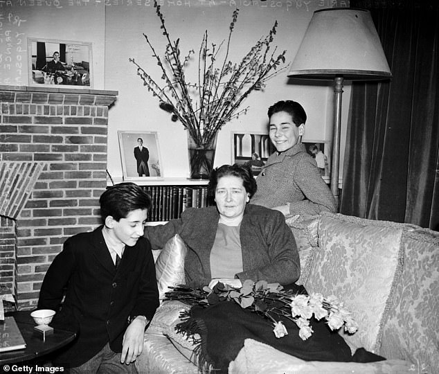 Queen Maria, mother of King Peter of Yugoslavia, in her English country house with her two younger sons, Prince Andrej (left) and Prince Tomislav