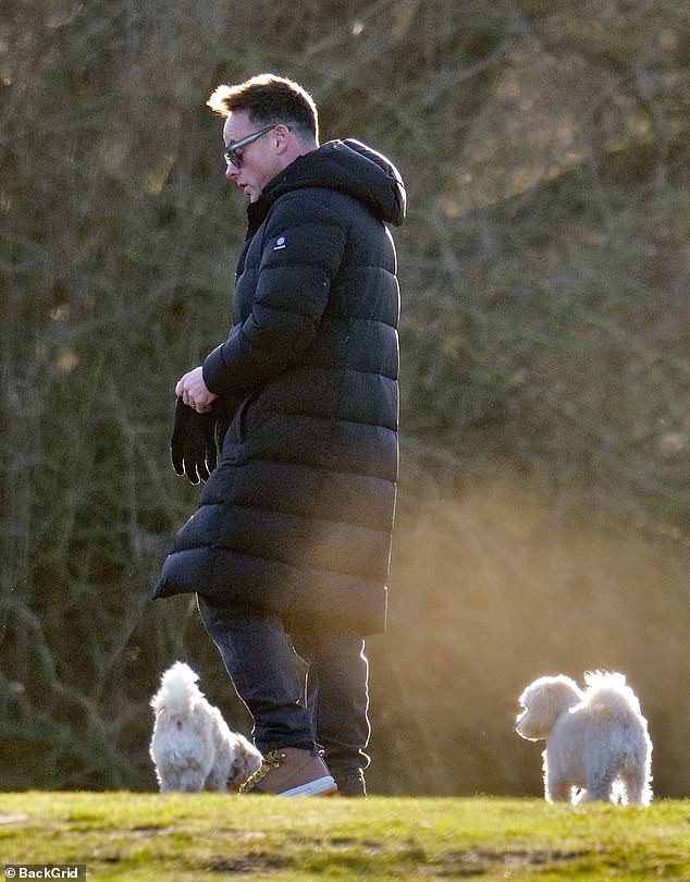 The presenter appeared to enjoy some rays of sunshine despite the cold as he returned to his Range Rover