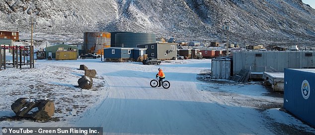 Klaus says, as drone footage shows the alien landscape: 'Fascinating place, incredible views, mountains around us, glaciers, lots of icebergs, lots of ice'