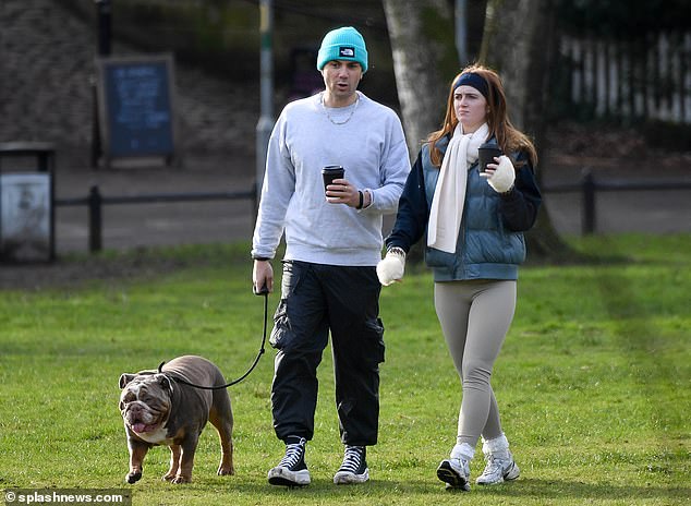 Meanwhile, her boyfriend Max, on the other hand, wore a casual gray sweatshirt and black cargo pants