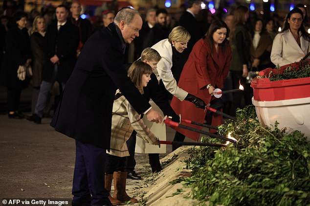 All eyes were on Monaco's royal family as they lit some foliage and watched a boat go up in flames