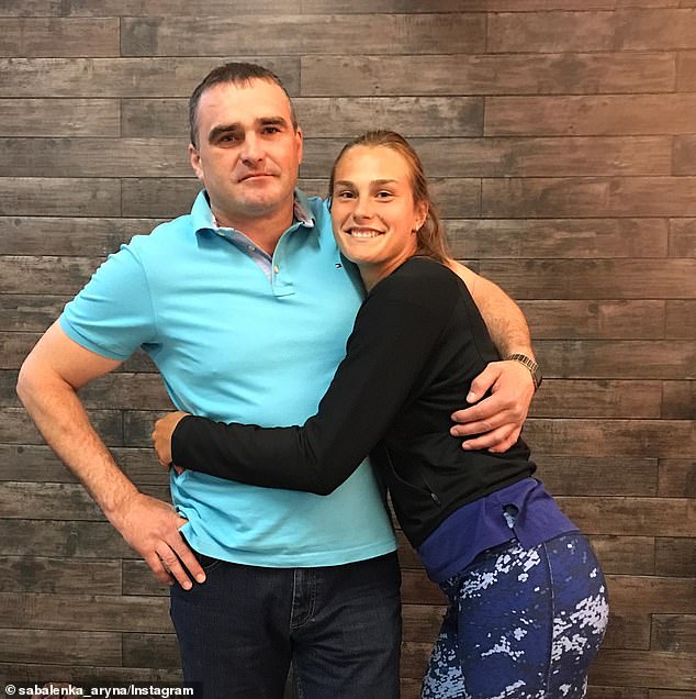 Sabalenka is pictured with her father Sergey, who died unexpectedly in 2019 at the age of just 43.  She gave him a kiss after winning her second grand slam on Saturday night.