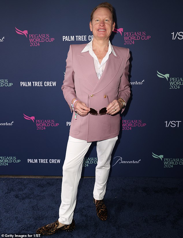 Queer Eye alum Carson Kressley stood out in a muted pink jacket styled with bright white pants