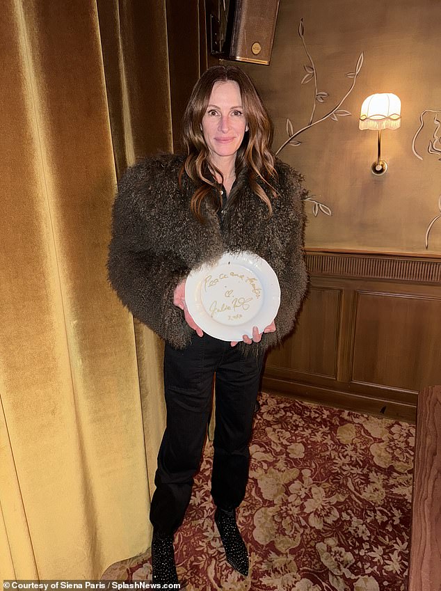 In the photos, the Pretty Woman star looked warm and cozy, wrapped in a brown fur jacket.  She wore black straight-leg pants and sparkling pointed-toe boots.  In her photos, she posed in front of a wallpaper with gold leaf drawings, similar to the backdrop Rihanna posed in front of a few days earlier.