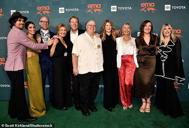 Somerhalder hugged his wife as they posed for a group photo with Laura Dern