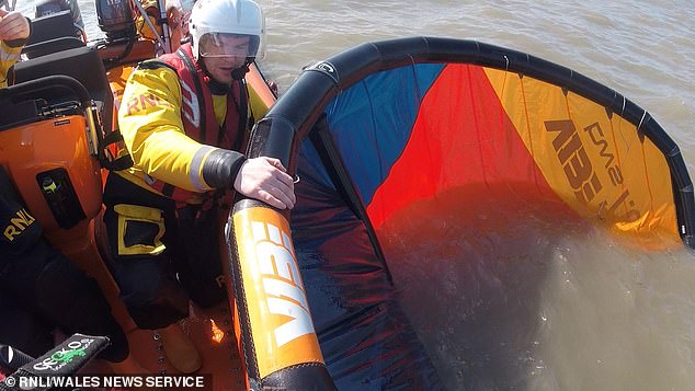 SUPERHERO VICAR: Mark at sea with his lifeboat crew