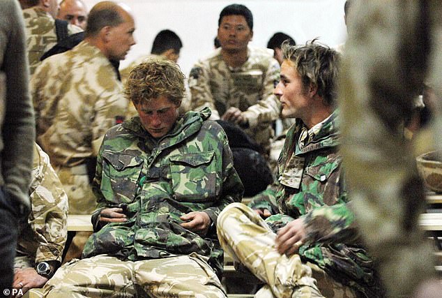 Prince Harry sits among officers and men from the three services plus friends from his own regiment as he awaits his flight back to the UK after serving for ten weeks in Afghanistan before his cover was blown by the foreign press