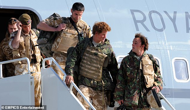 Prince Harry steps off a plane as he returns from Afghanistan at RAF Brize Norton on March 1, 2008