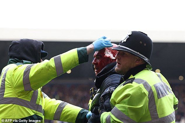 Guards tried to stop the bleeding as they led the man away