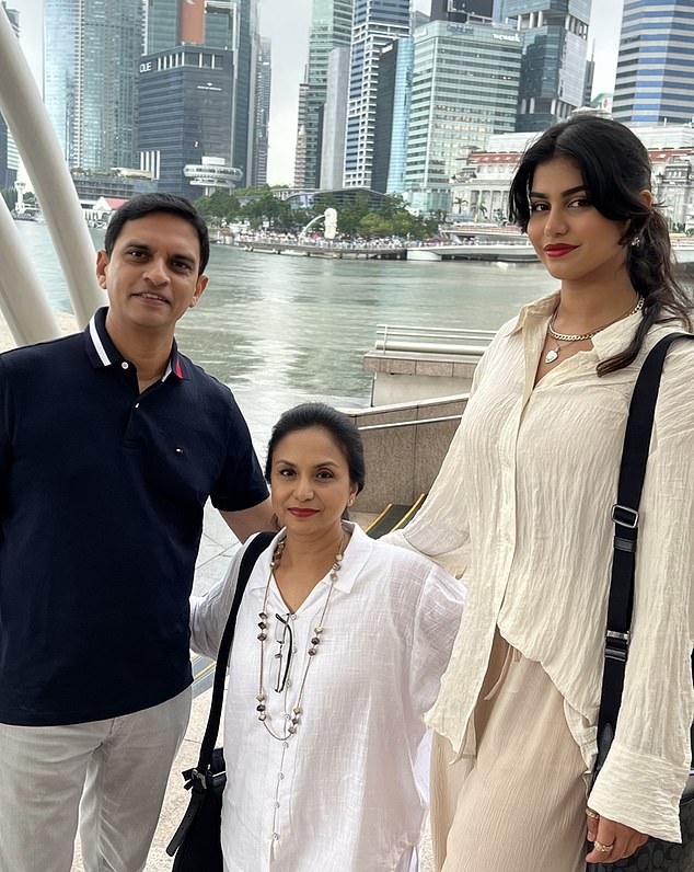 Ria pictured with her parents during a business trip to Singapore