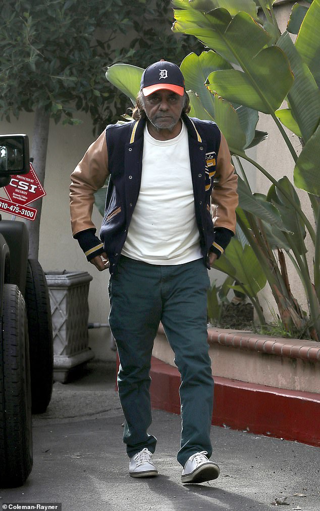 The legendary crooner wore a sporty Ralph Lauren Polo letterman jacket, green pants, white sneakers and a Detroit Tigers baseball cap