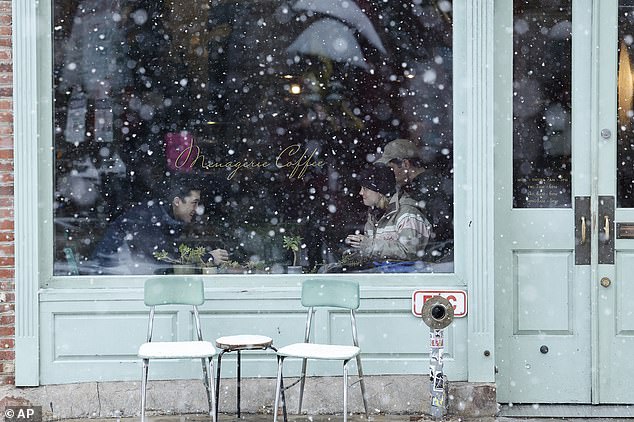 Rain and fog along Interstate 95 in the mid-Atlantic and Interstate 81 from central Pennsylvania and south may impact visibility (Photo: Customers in a snowy store in Philadelphia)