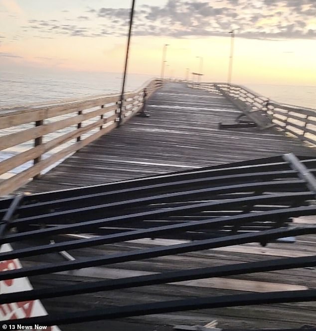 The car drove through two barriers and reached the end of the pier