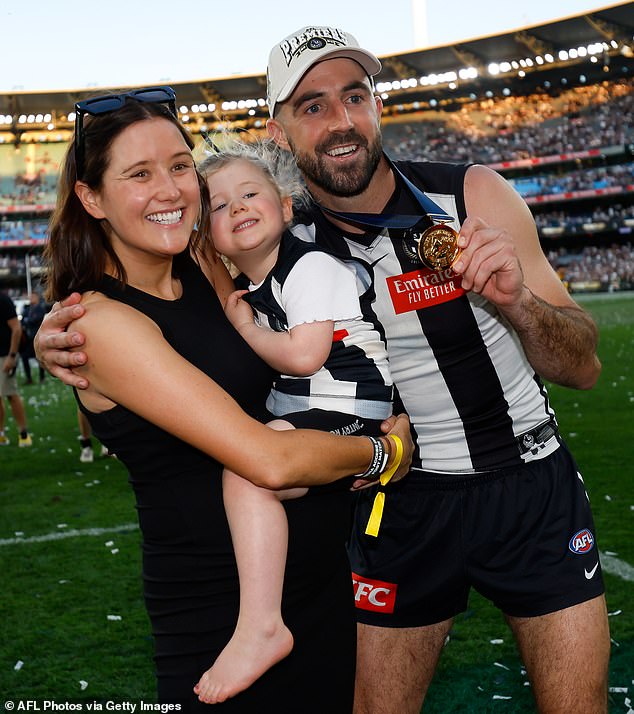 Alisha Sidebottom (pictured with Steele and their daughter Matilda after Collingwood's win in last year's grand final) recently broke her kneecap in a fall