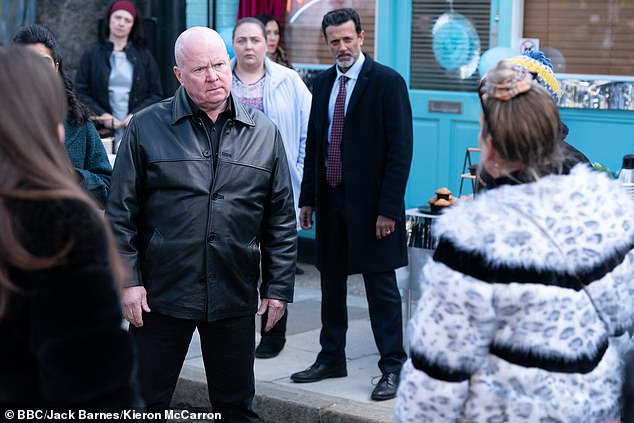 Karen immediately finds an enemy on her return in Phil Mitchell (Steve McFadden, centre) as he demands the stolen £500,000 ransom for the kidnapping.