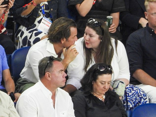 The couple looked enamored with each other as they watched the match