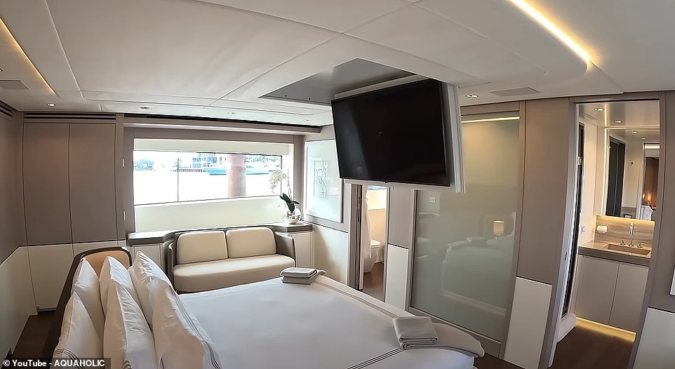 The pièce de résistance is the owner's cabin with a gigantic central bed, a TV that folds down from the ceiling and two heads with a huge walk-in shower connecting the two toilets in the middle.