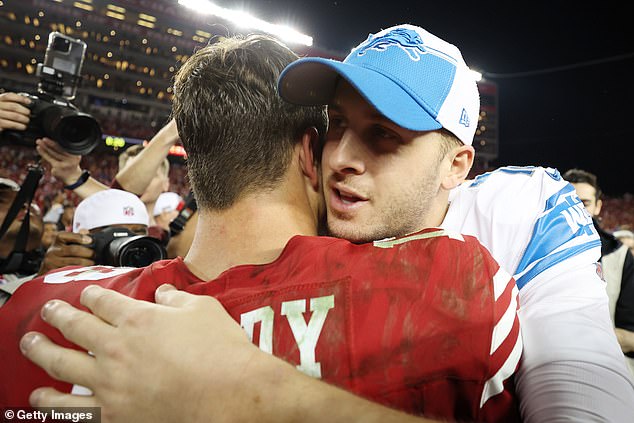 Purdy (left) hugs rival quarterback Jared Goff after victory in San Francisco