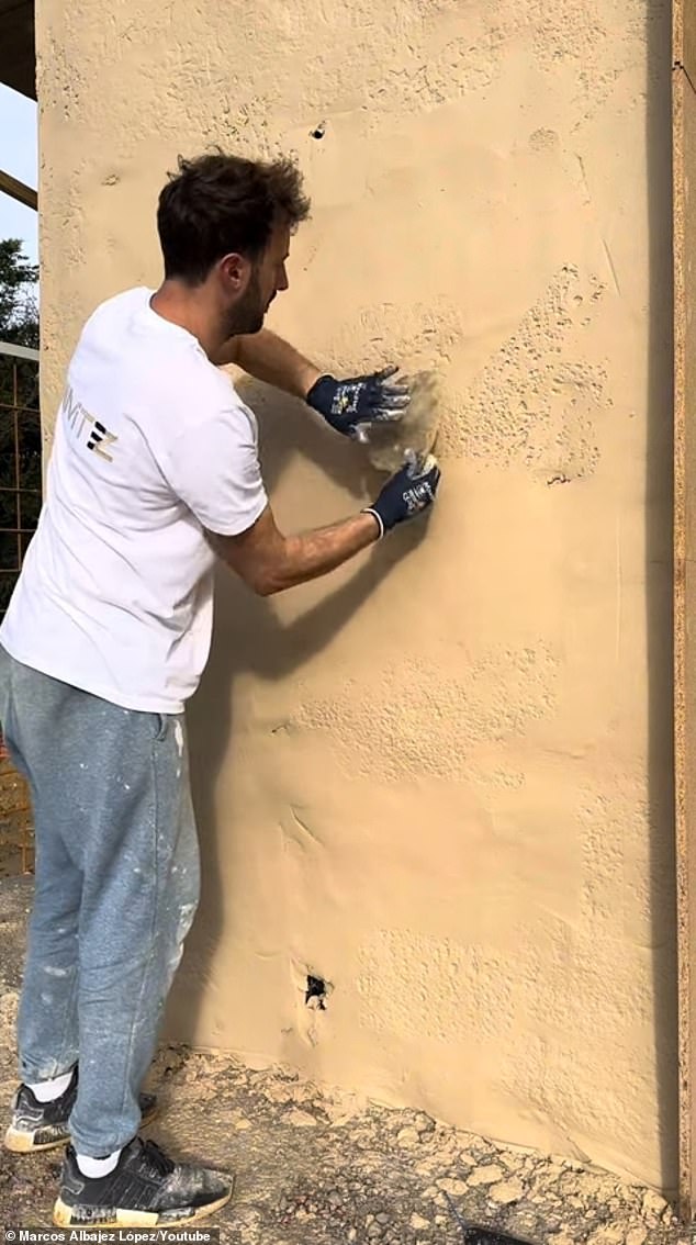 After applying concrete to the wall and making sure the surface was smooth, Marcus used tools, including a custom paint roller and a silicone mold, to create a rock-like texture