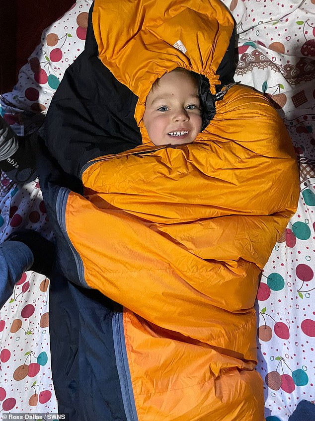 Carter Dallas, 2, in a sleeping bag during his family trip through Southeast Asia