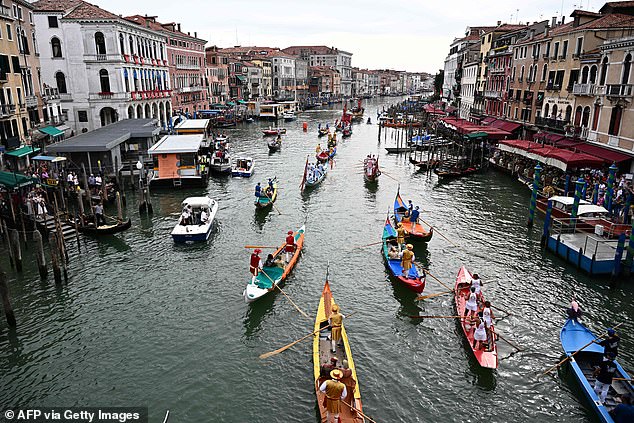 The city's canals are often full of ferries, motorboats, gondolas and other types of vessels, especially during the peak summer season (Stock Image)