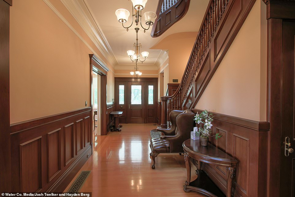 It has an impressive hall with wood panelling