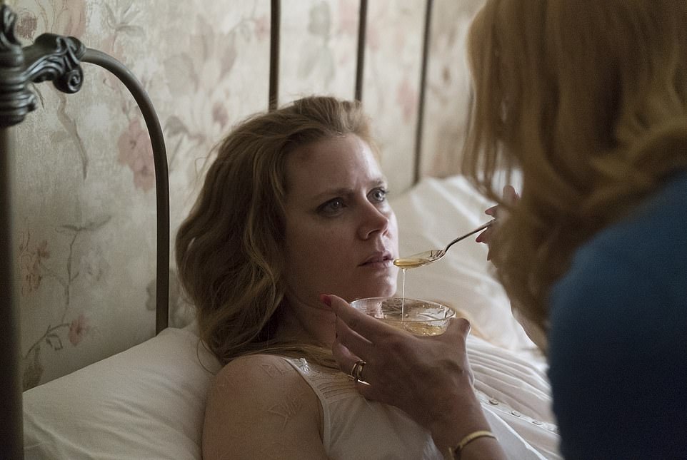 Sharp Objects, based on the book of the same name by Gillian Flynn, debuted on HBO in July 2018.  Pictured: Adams as Camille Preaker in the house