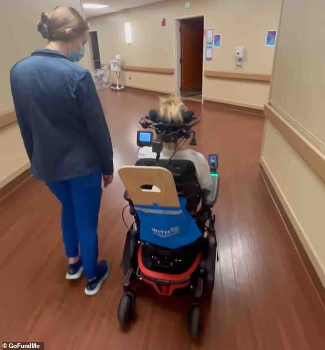 The mother-of-two uses her head to steer a mobility scooter around the hospital