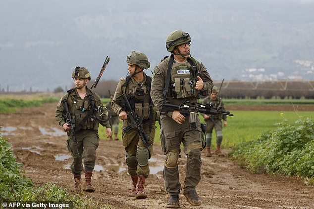 Israeli soldiers patrol an area near the northern kibbutz of Kfar Blum, close to the border with Lebanon, on January 25