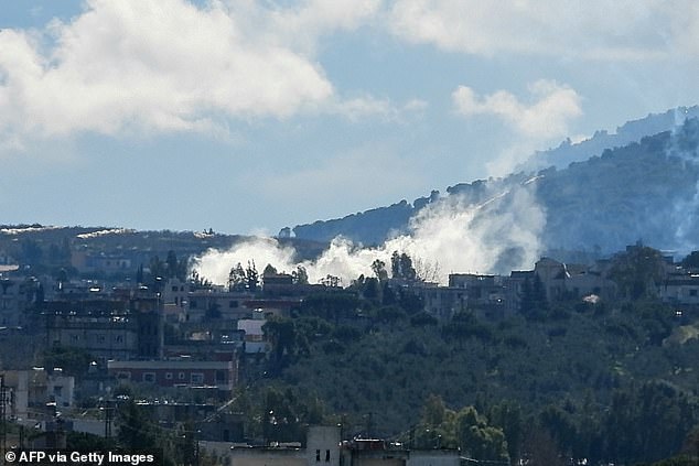 Smoke rises after Israeli shelling on the outskirts of the southern Lebanese village of Kfar Kila near the border with Israel on January 29, 2024