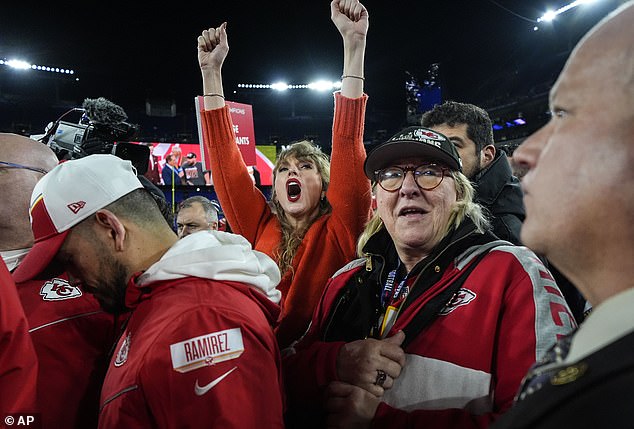 Taylor celebrates on the field after watching Travis reach back-to-back Super Bowls