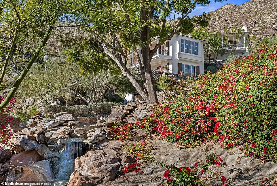 The expansive estate is nestled into the mountainside overlooking Palm Springs, California