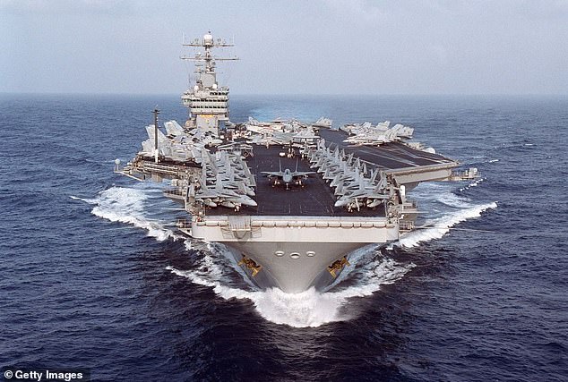 The US Navy's tremendous firepower is demonstrated by the aircraft carrier USS Dwight D. Eisenhower during a cruise in the Arabian Gulf in 2000