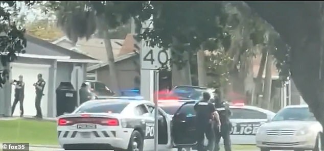 Some used the door of a patrol car as cover to protect themselves from the bullets