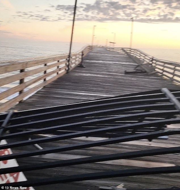 The car drove through three barriers and reached the end of the pier