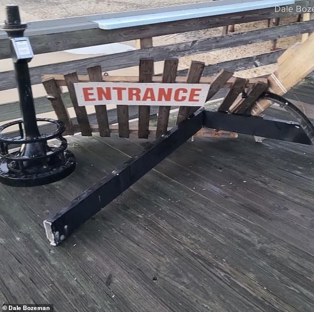 Some of the damaged barriers are on the ground at the pier entrance