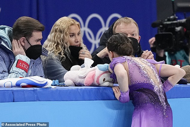 Coach Eteri Tutberidze, second from left, talks to Valieva at the 2022 Winter Olympics in Beijing