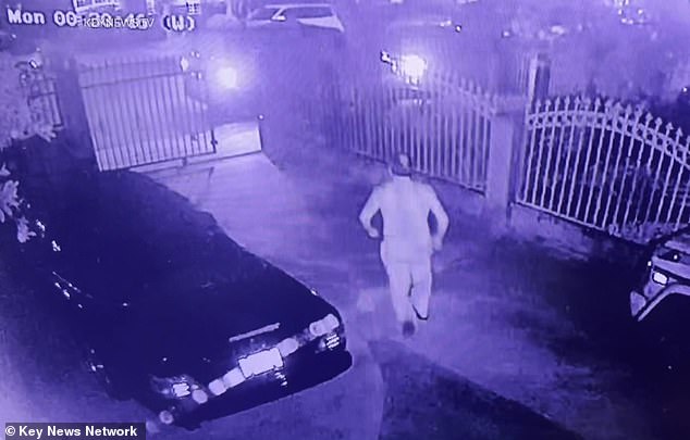 The man runs to stop the thieves as they steal tools and equipment from the van parked on the street