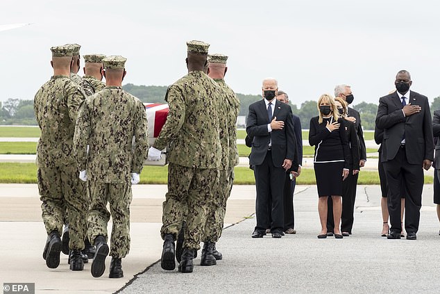 Joe and Jill Biden are seen at Dover Air Force Base on August 29, 2021, next to Lloyd Austin, the Secretary of Defense