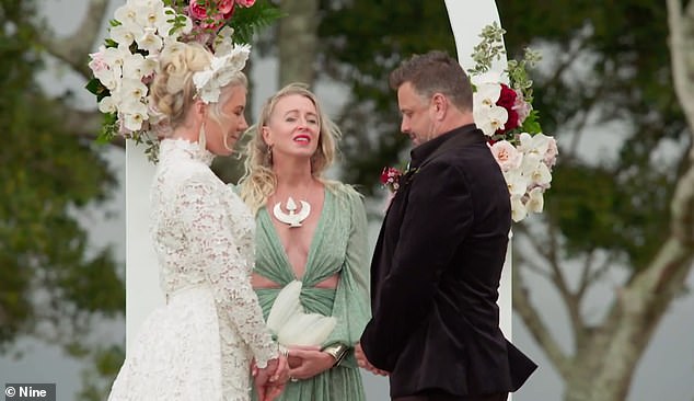 During the ceremony, Lucinda invited a celebrant to begin their wedding with a smoking ritual, waving a white-feathered 