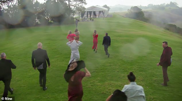 Guests frantically ran inside to take shelter during the freak storm