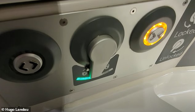 After manipulation: Note the small metal pin to the left above the green 'unlock' light.  This pin is intended to prevent the handle from being locked when the door is open