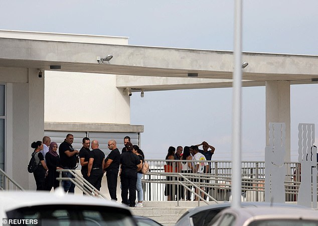 Relatives of Israeli men detained over the alleged rape of a British woman stand outside the courthouse in Paralimni during an earlier hearing in October