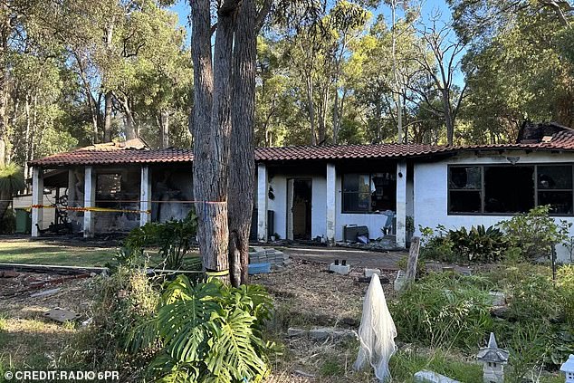 Police remain at the scene of a horror house fire in Perth where a woman tragically died