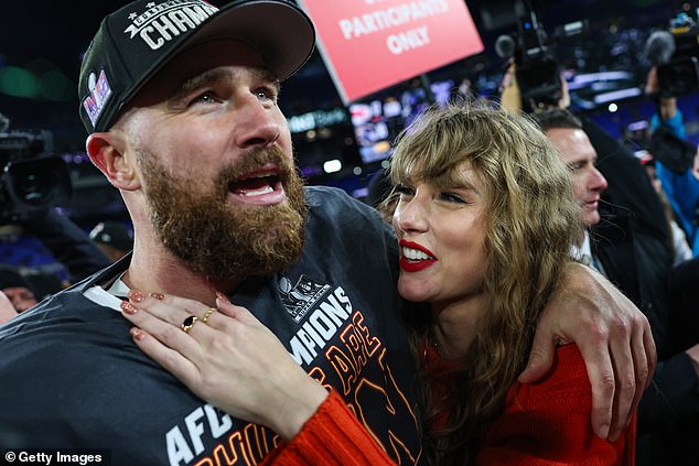 Kelce and girlfriend Taylor Swift celebrate together on the court after the win in Baltimore