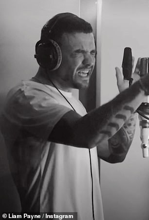 He looked casual in the black and white video, wearing a plain white T-shirt and dark jeans while wearing headphones.