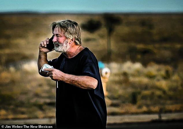 A distraught Alec Baldwin lingers in the parking lot outside the Santa Fe County Sheriff's Office on Camino Justicia after being questioned