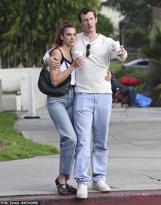 Callum placed a tender kiss on Dua's head as they stepped out arm-in-arm for a walk after being photographed together for the first time earlier this month