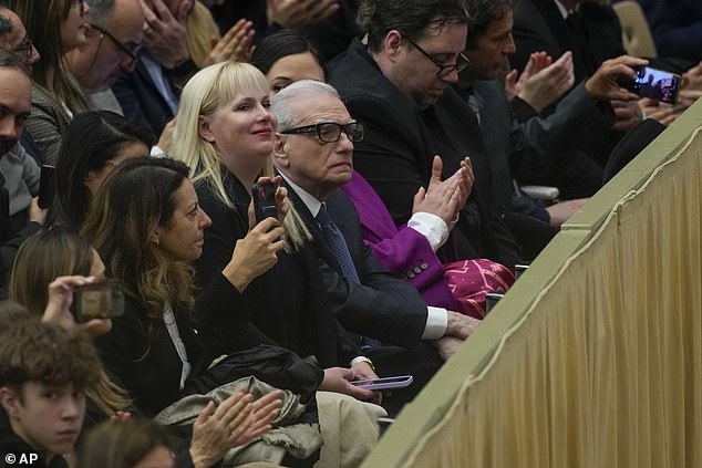 Director Martin Scorsese, center, flanked by his daughter Francesca, left, and actress Lily Gladstone, as he attends Pope Francis' weekly general audience in the Pope Paul VI Hall at the Vatican, Wednesday, January 31, 2024.