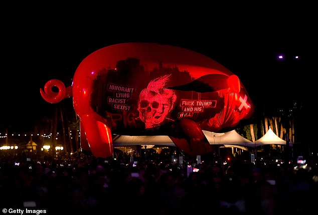 Pictured: An inflatable pig decorated with insults aimed at Donald Trump at a 2016 Roger Waters concert in California.  Claims have been made that Waters wanted a similar pig to be defaced with anti-Semitic language